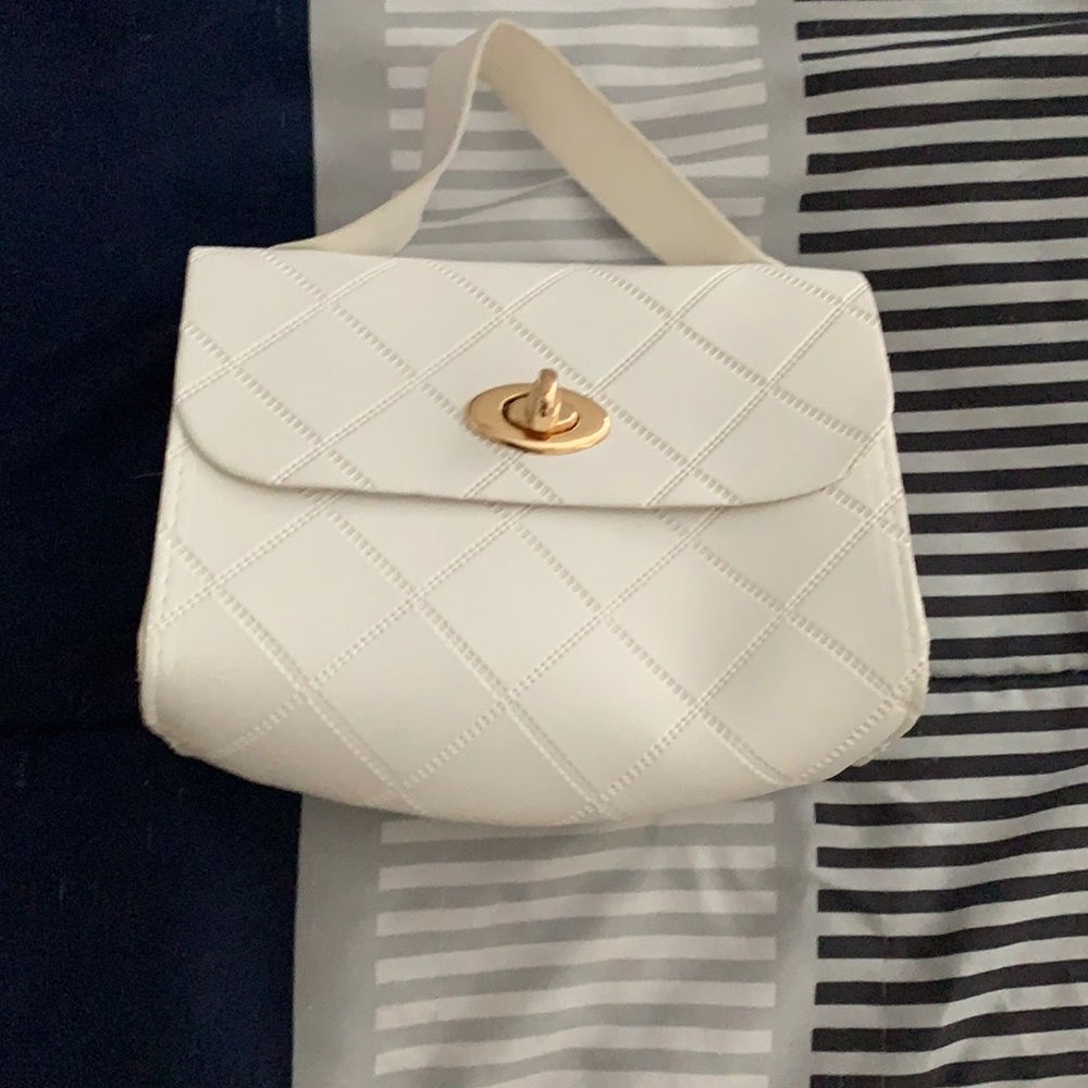 white purse w/ gold button
